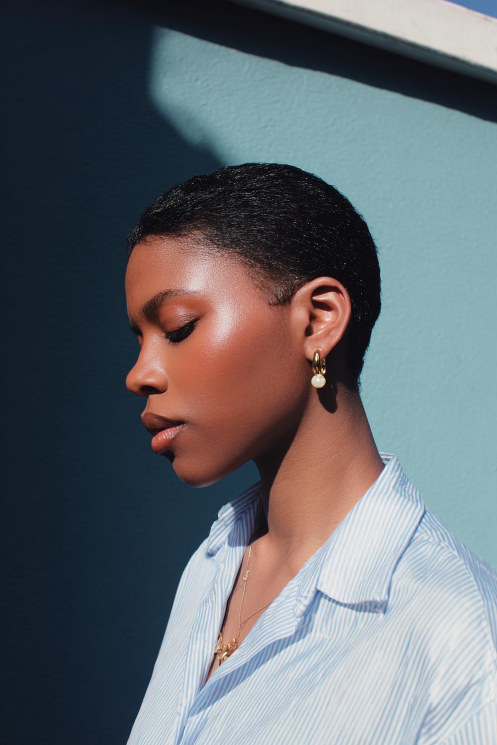 19. Fresh Hair Ideas 2026: Slicked Low Puff with Defined Part Lines