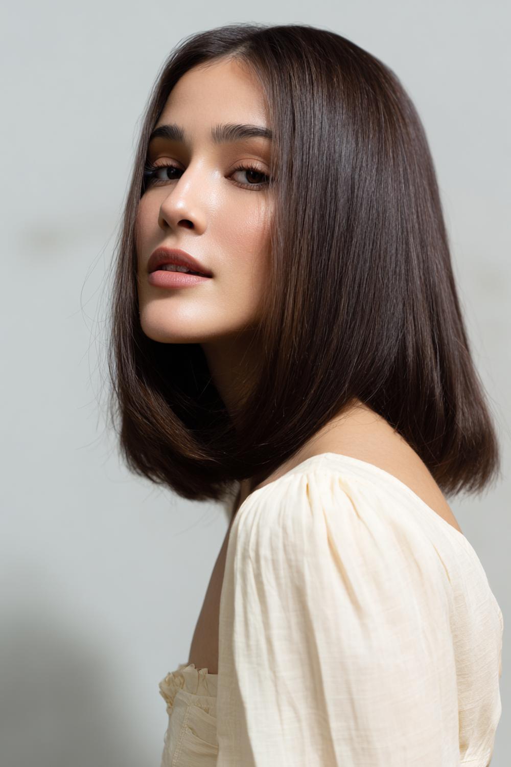 6. Modern Hair Looks 2026: Midi Lob With Subtle A-Line and Sleek Tuck-Behind