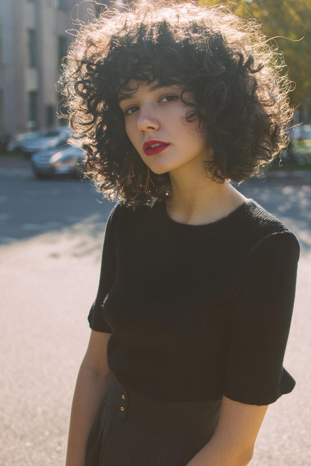 17. Pinterest Hair Inspiration 2026: Curly Fringe Cut with Rounded Shape and Defined Ringlets