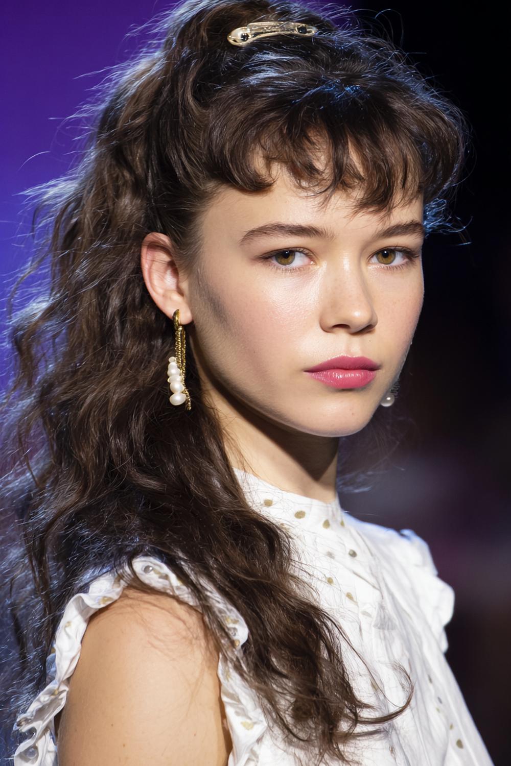 12. Popular Hairstyles 2026: Claw-Clip Twist With Face-Framing Tendrils and Soft Texture