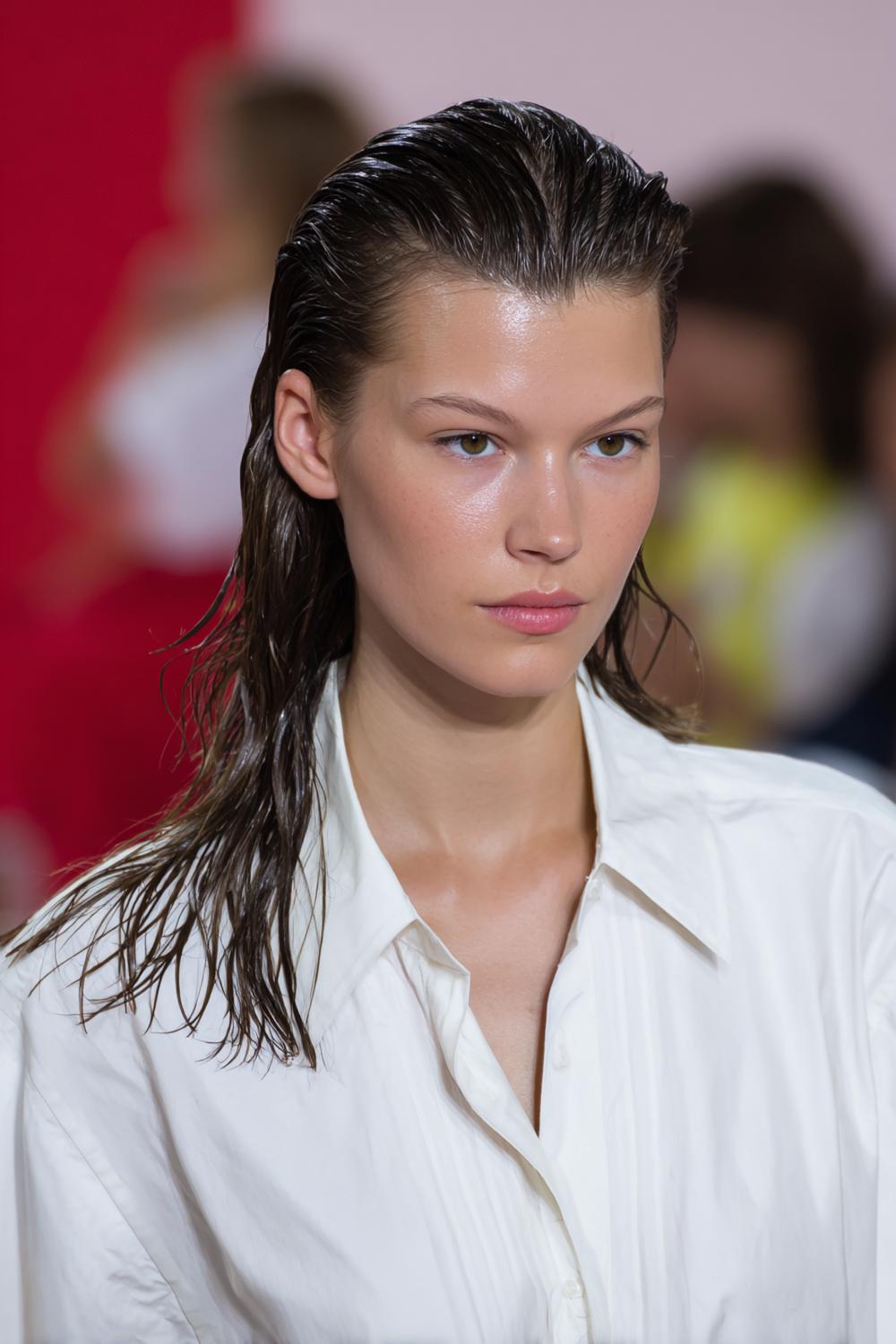 16. Popular Hairstyles 2026: Wet-Look Slick Back With Deep Side Part and Shine Gel